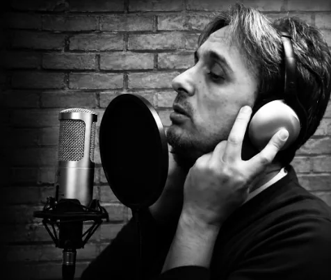 Galeazzo Frudua recording vocals in a studio